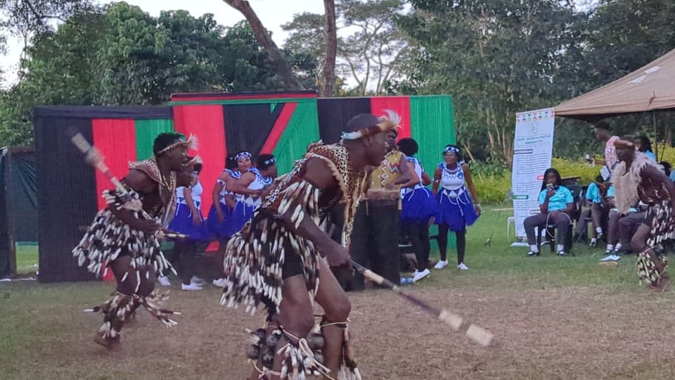 Troupe members celebrating with an award